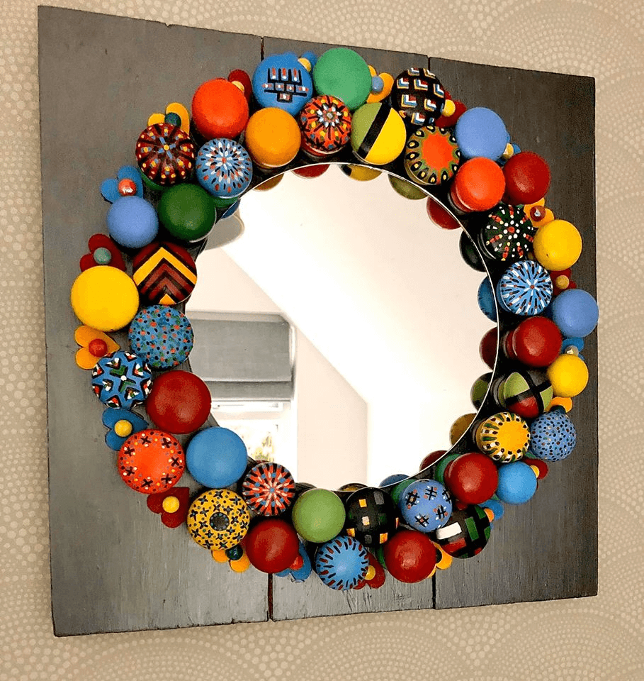 "Door Knob Mirror" Assemblage on wall by Emma Mullender