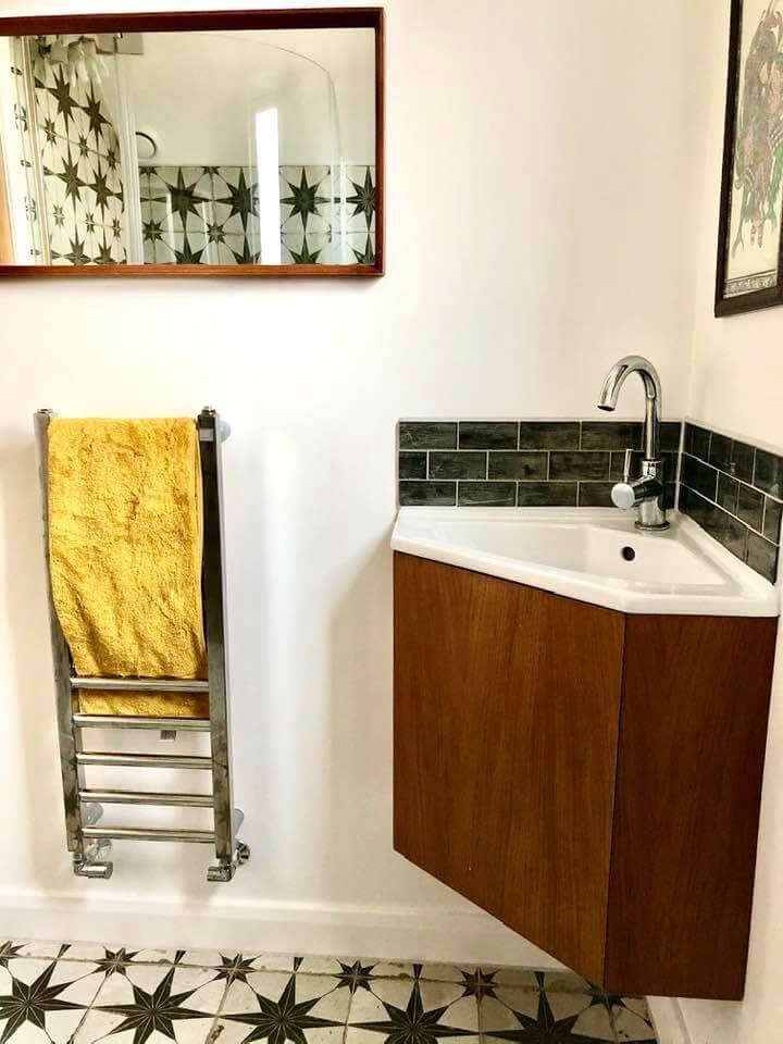 "Guest Shower Room interior styling" Bespoke cherry wood wall mounted vanity unit and retro mirror by Emma Mullender